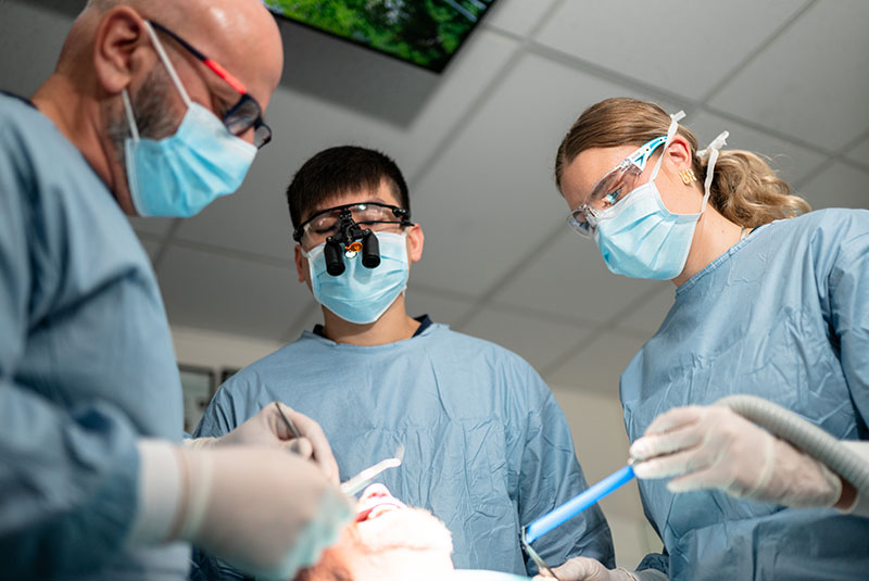 doctors in middle of dental procedure