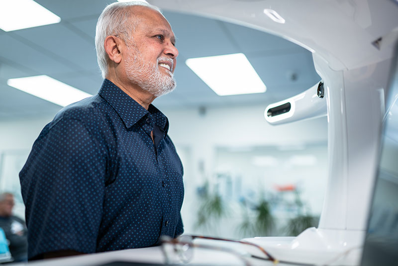 patient getting facial scan of teeth and face